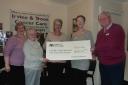 Chairman Andy Slater (right) receives the cheque from Woodlands Senior Citizens Club