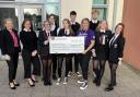 Greenwood pupils hand over £903 to hospice after Go Purple Day fund-raiser