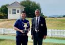 John Shanks is handed the Club Championship trophy for the eighth time by The Irvine Golf Club captain Stuart McInnes.