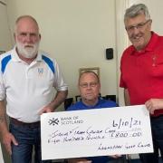 Kind golfers present £800 cheque to help out cancer charity
