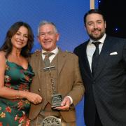 Malcolm Simpson collects his coveted corkscrew trophy alongside host for the evening Jason Manford.