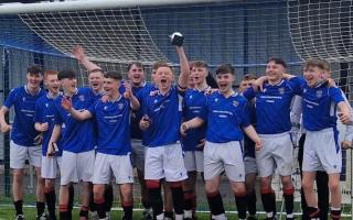 Irvine Meadow 2006 celebrate their league cup win.