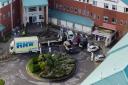 Aerial view of damaged car being removed by forensic officer after the  explosion at the Liverpool Women's Hospital that killed one person and injured another on Sunday. Suspected terrorist Emad Al Swealmeen, 32, died after the device exploded in a