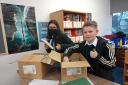 Pupils presented with new books as classes resume at Irvine Royal