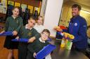 St Winning's Primary breakfast club withTesco manager Niall Davey