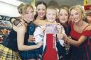 Bryan McNally, 11, gets a cuddle from the girls