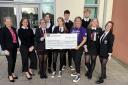 Greenwood pupils hand over £903 to hospice after Go Purple Day fund-raiser