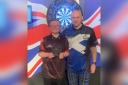 Kyle Davidson is handed his runner-up prize by Scottish darts star Alan Soutar who sponsored the JDC Scottish National Championship.