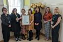 NHS staff and members of Ayrshire's Health and Social Care Partnerships with their UNICEF award