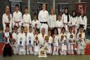 The new judo red belts at the ceremony