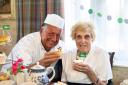 Chef Wayne Woolman and resident Joyce Wardle have been busy baking for Macmillan