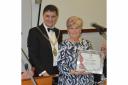 Irvine Burns Club President Angus Middleton presents Annie with her award