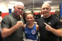 Irvine Vineburgh boxer Brooke Neely (pictured centre) with coach Alec Mullen (left)
