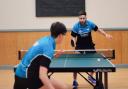North Ayrshire Table Tennis Club members Jordan McGinlay (far side facing the camera) and Jamie Johnson (this side facing away from camera) in action.