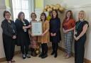 NHS staff and members of Ayrshire's Health and Social Care Partnerships with their UNICEF award