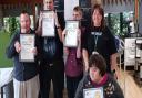 The Trindlemoss team show off their awards