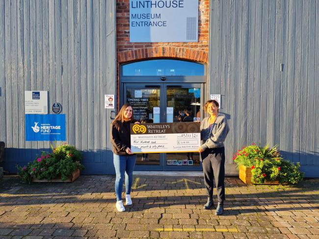 Sarah Johnstone, Community Awareness Manager at Whiteleys Retreat receives a cheque for £406 from Nicola Scott, Event and Exhibitions Officer at the Scottish Maritime Museum.