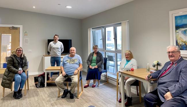 Councillor Jim Montgomerie, Cabinet Member for Green New Deal and Sustainability, and Councillor Jimmy Miller, North Ayrshire’s Older People’s Champion, meet residents in the communal lounge at Kyleshill Court, Saltcoats.