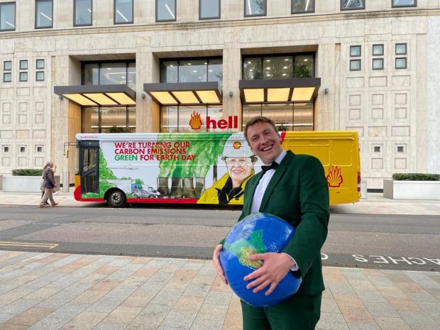 Irvine Times: Joe Lycett outside of Shell's Headquarters in London, perfoming a stunt as part of his documentary Joe Lycett vs The Oil Giant, which explores the energy company, its marketing and its exploration for new oil reserves. Photo via PA.