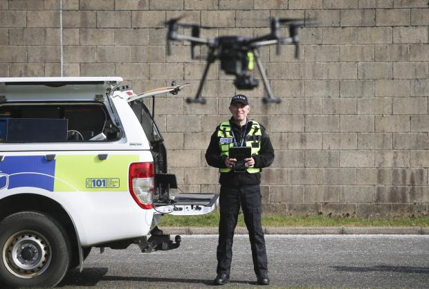 Irvine Times: Inspector Nick Whyte of the Police Scotland Air Support Unit with drone at Jackton, East Kilbride. MISSING PERSONS feature STY..Pic Gordon Terris Herald & Times..23/3/22.
