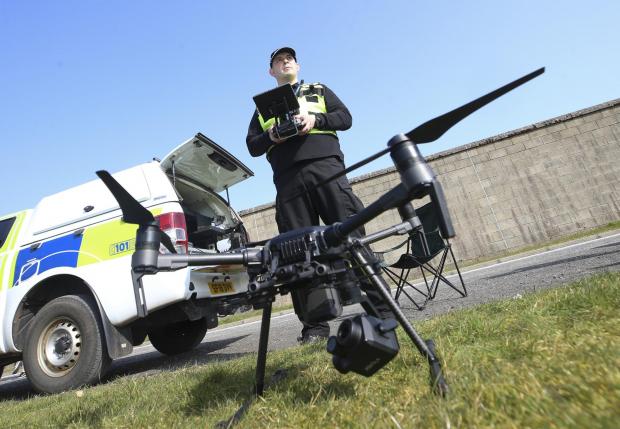 Irvine Times: Sgt Steven Pollock of the Police Scotland Air Support Unit with drone at Jackton, East Kilbride. MISSING PERSONS feature STY..Pic Gordon Terris Herald & Times..23/3/22.