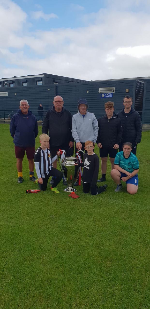 Irvine Times: Some lucky youngsters and walking footballers got their hands on the trophy! Pic Credit: Kilwinning Community Sports Club