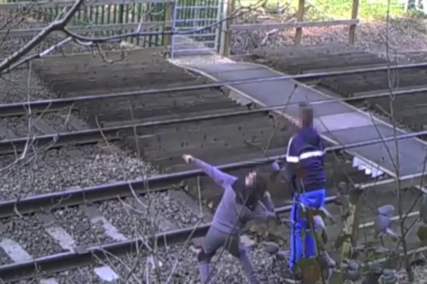 Still from undated handout footage issued by British Transport Police of people risking their lives by trespassing on Britain's railways, as new figures show their number has reached an all-time high. PRESS ASSOCIATION Photo. Issue date: Thursday