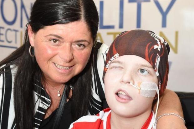 Mum gives back to charities who helped son through cancer