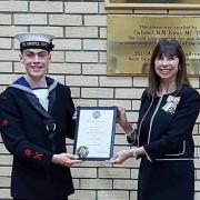 Lord-Lieutenant Iona McDonald OBE presents Luke with a certificate