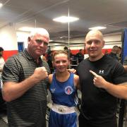 Irvine Vineburgh boxer Brooke Neely (pictured centre) with coach Alec Mullen (left)