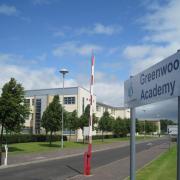 A fight between pupils from Irvine's Greenwood Academy was viewed by millions on the social media platform Twitter.