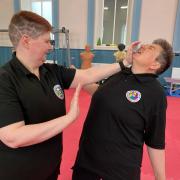 Steven strikes Yvette during a training session
