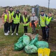 Irvine Clean Up Crew with the bags of rubbish collected from the beach