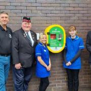 The Legion members with Gallagher's and St John's staff and the new defibrillator