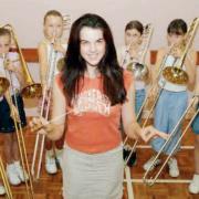 Greenwood Academy’s pupil tutor Aimee McMillan conducts her six trombone students at the brass for beginners summer school which was held in 2003.