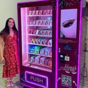 Company founder Meggi Morgan with the lashes vending machine in Irvine.